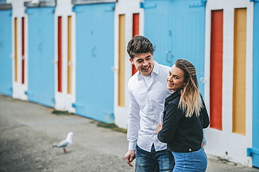 Young man and young woman smiling and laughing together; Wellington, North Island, New Zealand