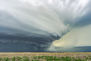 Dramatic dark storm clouds over farmland; Imperial, Nebraska, United States of America