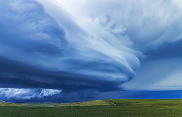 Dramatic dark storm clouds over farmland; Guymon, Oklahoma, United States of America