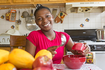 Teen suffering from Bipolar Disorder squeezing Pomegranate