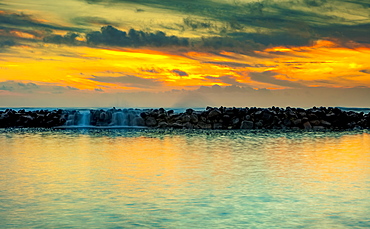 Breakwater off the shore of Lydgate Beach at sunrise, Lydgate Park; Kapaa, Kauai, Hawaii, United States of America