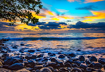 Sunrise over the Pacific Ocean from the shore of Lydgate Beach; Kapaa, Kauai, Hawaii, United States of America