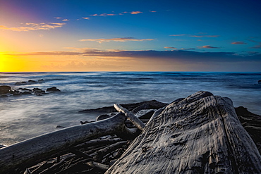 Sunrise over the Pacific Ocean from the shore of Kauai; Kauai, Hawaii, United States of America