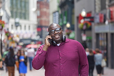 Man with ADHD talking on a mobile phone