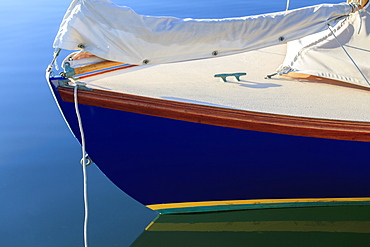 Sailboat bow on mooring in calm water