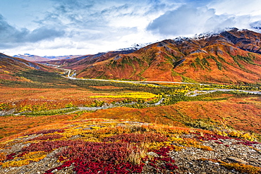 Brooks Mountains and Dalton Highway in fall colours, Gates of the Arctic National Park and Preserve, Arctic Alaska in autumn; Alaska, United States of America