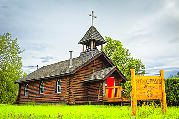 Historic log building of St. Mark’s Episcopal Church, Interior Alaska in summertime; Nenana, Alaska, United States of America