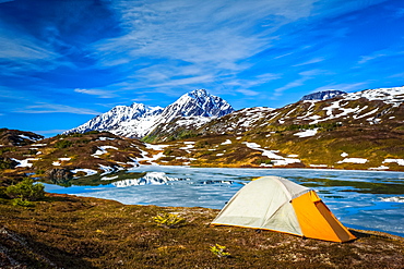 Camping at Lost Lake, Resurrection Peaks in the background. Chugach National Forest, Kenai Peninsula, South-central Alaska in springtime; Seward, Alaska, United States of America