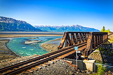 Alaska Railroad track crossing Bird Creek mouth with Turnagain Arm of Cook Inlet, South-central Alaska in summertime; Portage, Alaska, United States of America