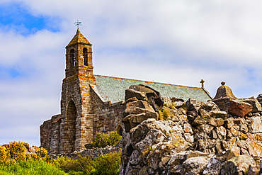 A view of the exterior and bell tower of the Lindisfarne Priory on Holy Island: Northumberland, England