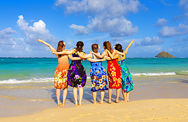 A group of Japanese students on vacation at Lanakai Beach with the Mokes Islands in the background: Oahu, Hawaii, United States of America