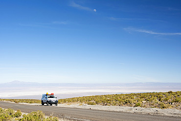 A 4x4 expedition truck is parked along a high altitude road over the desert; San Pedro de Atacama, Atacama, Chile