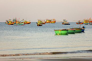 Colourful fishing boats moored in the water, Ke Ga Cape; Ke Ga, Vietnam