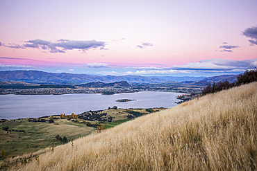 The strenuous yet highly rewarding hike to Roys Peak in Wanaka. The hike is difficult but the views are spectacular. This is the view of Lake Wanaka from Roys Peak at sunset; Wanaka, Otago, New Zealand