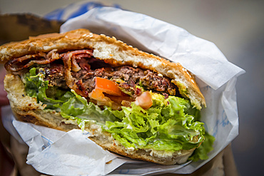 Close-up of Queenstown's most famous burger, the Ferburger; Queenstown, Otago, New Zealand