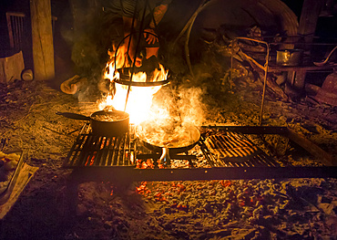 The Blue Duck lodge located in the Whanganui National Park is a working cattle farm with a focus on conservation. Fresh food is cooked over the campfire; Retaruke, Manawatu-Wanganui, New Zealand