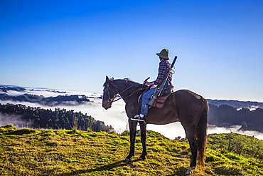 The Blue Duck lodge located in the Whanganui National Park is a working cattle farm with a focus on conservation. Travellers go to a scenic viewpoint to watch the sunrise over the rainforest; Retaruke, Manawatu-Wanganui, New Zealand