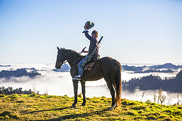 The Blue Duck lodge located in the Whanganui National Park is a working cattle farm with a focus on conservation. Travellers go to a scenic viewpoint to watch the sunrise over the rainforest; Retaruke, Manawatu-Wanganui, New Zealand