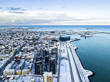 Views over the city centre of Reykjavik. The famed Harpa opera house sits on the edge of the ocean port; Reykjavik, Iceland