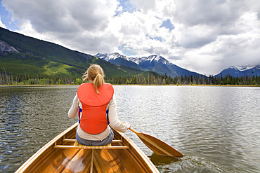 Girl Canoeing in Vermilion Lakes, Banff National Park, Alberta, Canada