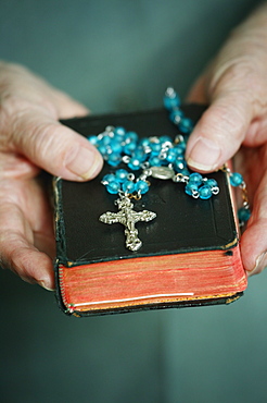 Rosary Beads & Bible Held