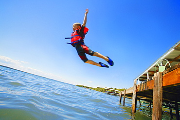 A Boy Jumps Into The Lake