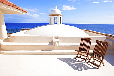 Two Chairs Waiting In A Tropical Paradise