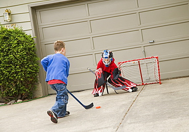 Young Goalie Anticipating A Shot On Net