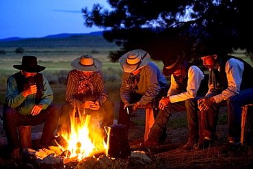 Group Of Cowboys Around A Campfire