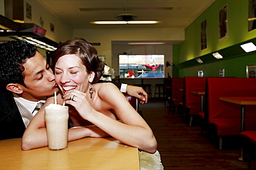 Front View Of A Couple Drinking In A Restaurant