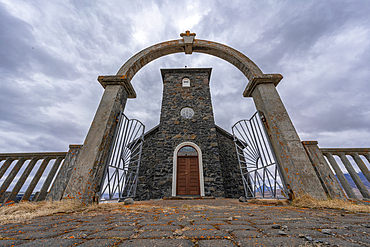 Archway and front entrance to Þingeyrakirkja on a cloudy day. One of the oldest stone churches in Iceland, North Iceland, Iceland