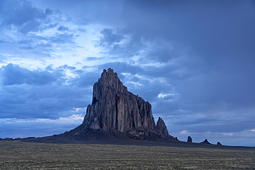 Clearing storm clouds over Shiprock in the high-desert plain of the Navajo Nation in New Mexico, USA, Shiprock, New Mexico, United States of America