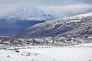 Snow-clad mountains in early winter in the Kaldidalur Valley, seen from Langjokull Glacier, in the western Highlands of west Iceland, Iceland