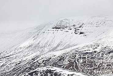 Snow-clad mountains in early winter in the Kaldidalur Valley, seen from Langjokull Glacier, in the western Highlands of west Iceland, Iceland