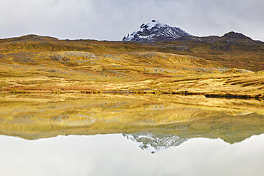 Mountains reflected in a tranquil lake at Valafell mountain pass, near Olafsvik, Snaefellsnes peninsula, west coast of Iceland, Iceland