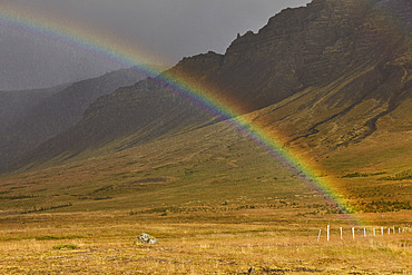 Rainbow stretches across a valley on the Snaefellsnes peninsula, on the west coast of Iceland, Iceland