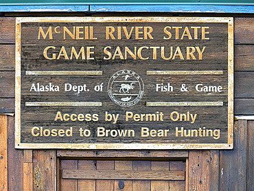 Close-up of a sign at the McNeil River State Game Sanctuary. McNeil River Camp is operated by the Alaska Department of Fish and Game. The Department hosts guests in small numbers throughout the summer and early fall and provides bear-viewing tours. Guests must enter and be drawn in an annual lottery to be granted access to this world-famous brown bear sanctuary, Alaska, United States of America