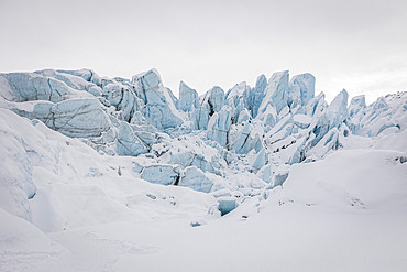 Spiky ice formations along the ice wall of the Matanuska Glacier on a cloudy day, Sutton, Alaska, United States of America