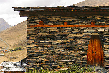 Wooden door with lock on historic stone house in the village of Dartlo in Tusheti National Park, Dartlo, Kakheti, Georgia