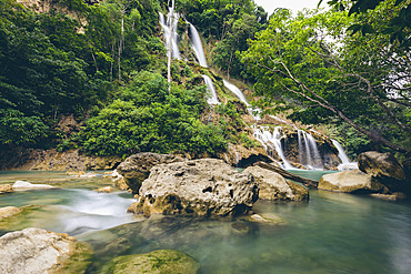 Beautiful cascading series of waterfalls (Lapopu Waterfall) flowing down a hillside on the island of Sumba, East Nusa Tenggara, Indonesia, Katikutana Selatan, Central Sumba Regency, East Nusa Tenggara, Indonesia