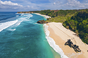 Expanse of Mbawana Beach with the surf rolling into the rugged coastline, East Nusa Tenggara, Indonesia, Kodi Bangedo, Southwest Sumba Regency, East Nusa Tenggara, Indonesia