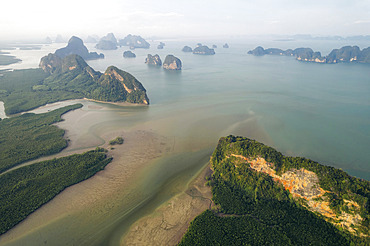 Karst rock formations and fog in Ao Phang Nga National Park in Thailand, Ao Phang Nga, Phang-nga, Thailand