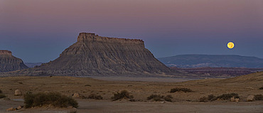 Beautiful Factory Butte and the moon setting in rural Utah, USA, Hanksville, Utah, United States of America