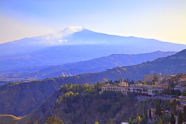 View from Greek Theatre to Taormina with Mount Etna in background, Taormina, Sicily, Italy, Europe