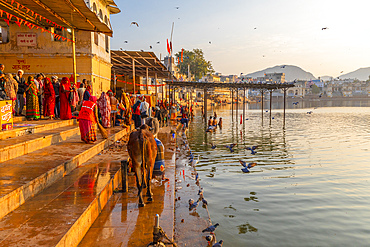 Pilgrims at Pushkar Lake at sunrise, Pushkar, Rajasthan, India, South Asia, Asia