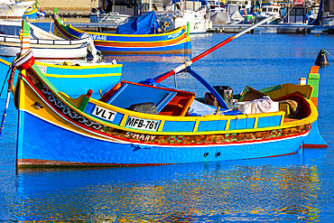 A Colourful Luzzu with the Eye of Osiris in Marsaxlokk Harbour, Marsaxlokk, Malta, Southern Europe