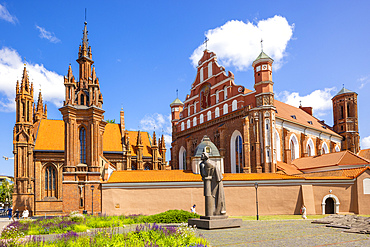 A Statue of the Polish Poet Adam Mickiewicz in front of St. Anne's Church and the Church of St. Francis and St. Bernard, Vilnius, Lithuania, Northern Europe