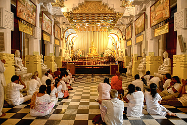 Temple of the sacred Tooth Relic or Sri Dalada Maligawa, Pilgrims in the New Shrine room or Alut Maligawa, Kandy, Sri Lanka