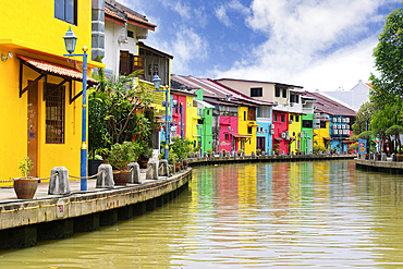 Colorful old houses converted into restaurants or shops along the Malacca or Melaka river riverfront, Malacca, Malaysia
