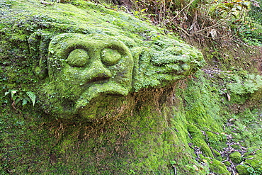 Moss covered sculptures in the forest, Goa Gajah Elephant Cave complex, Bali, Indonesia, Southeast Asia, Asia